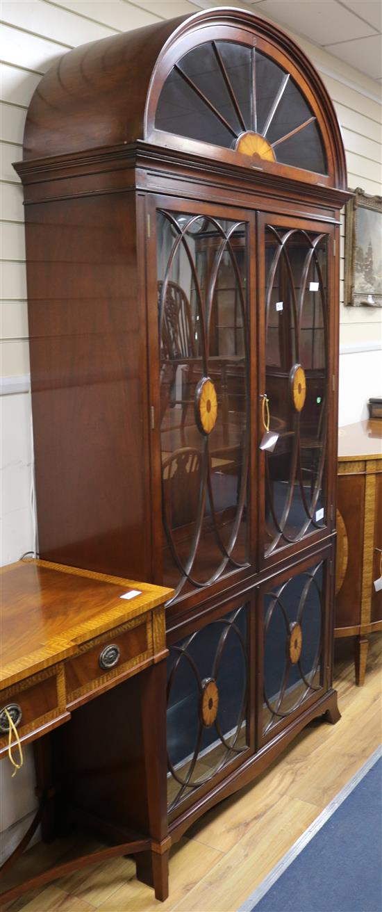 A George III style mahogany domed top bookcase W.112cm